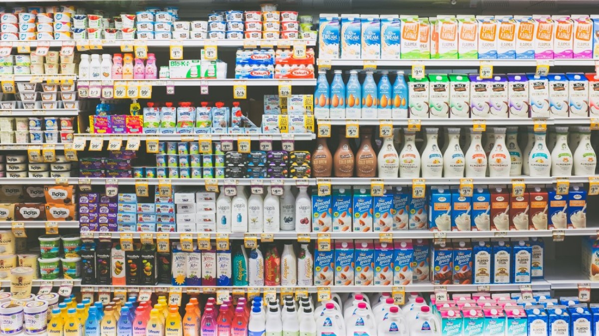 Various Milks Grocery Store Display Photo credit: Neonbrand on Unsplash